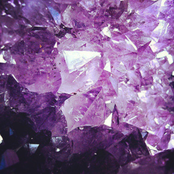 a purple rock with lots of other rocks