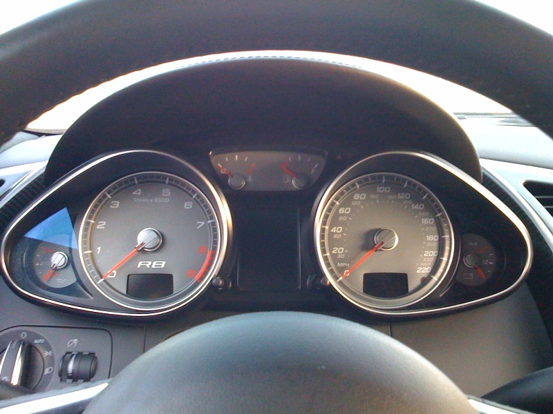 two gauges in front of the steering wheel in a car