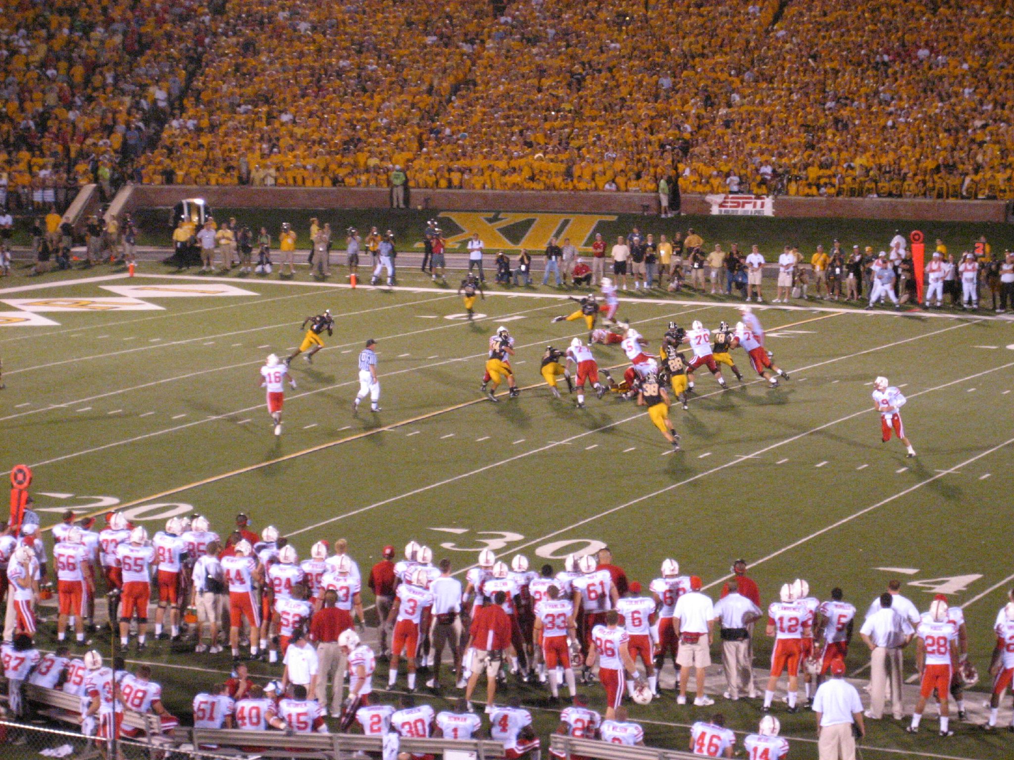 a football game being played with the teams on the field
