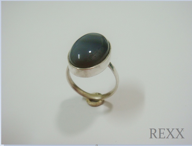 an oval ring with a stone is shown