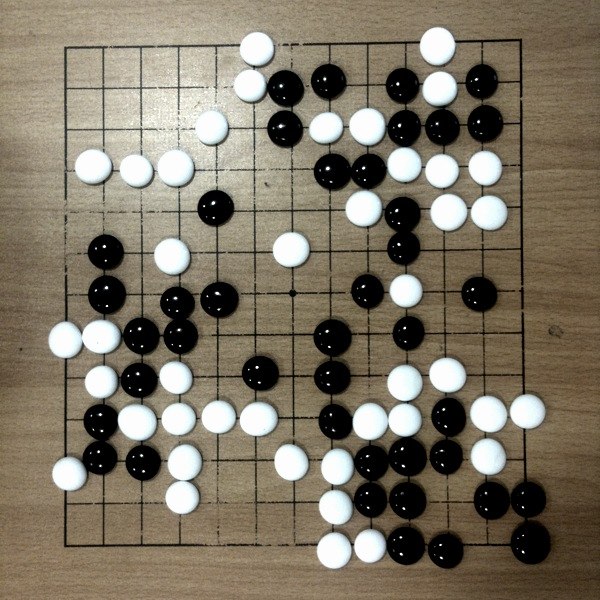 a chess board with some black and white pieces on it