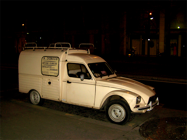 a utility van parked on a city street