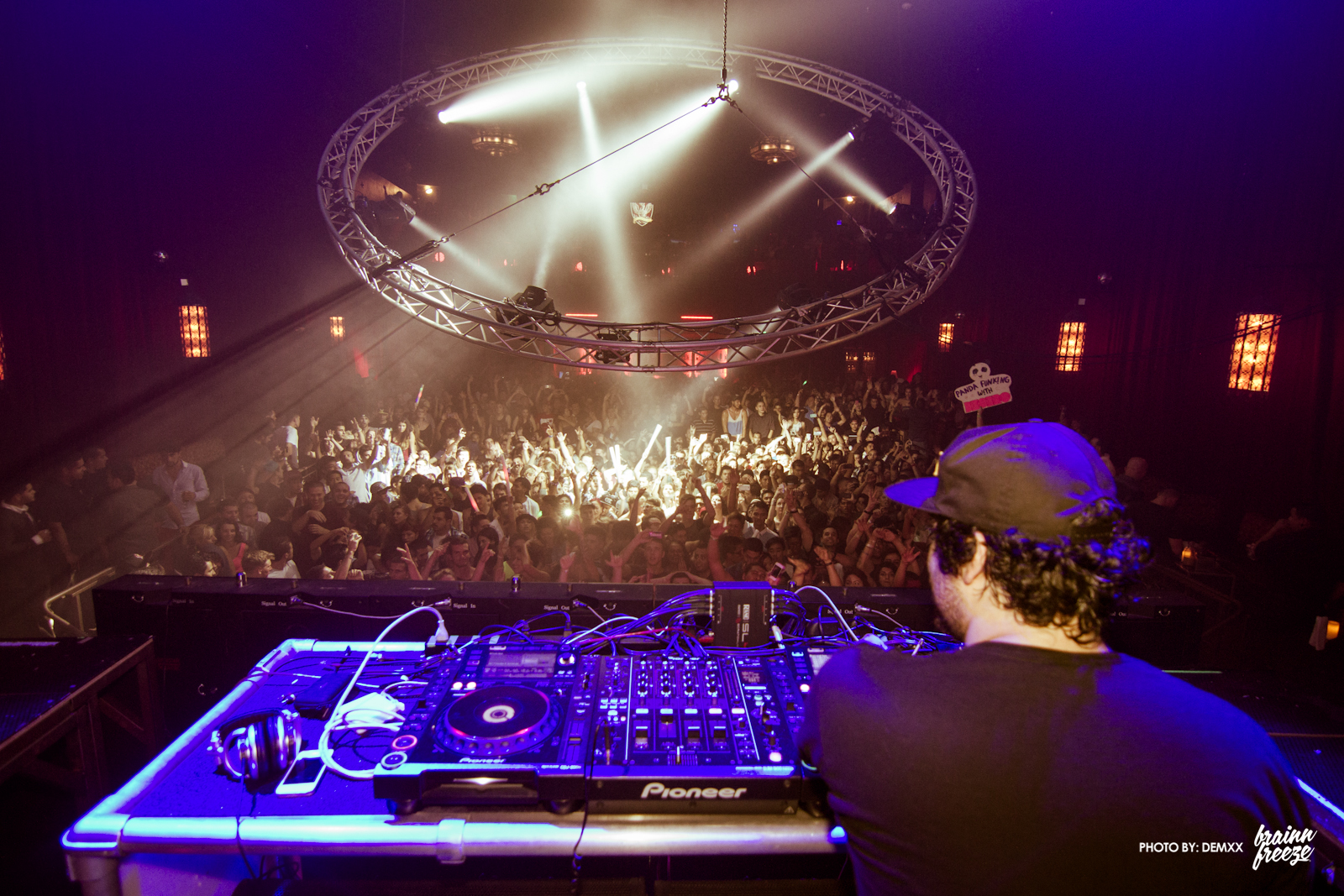 a dj set up in front of a crowd