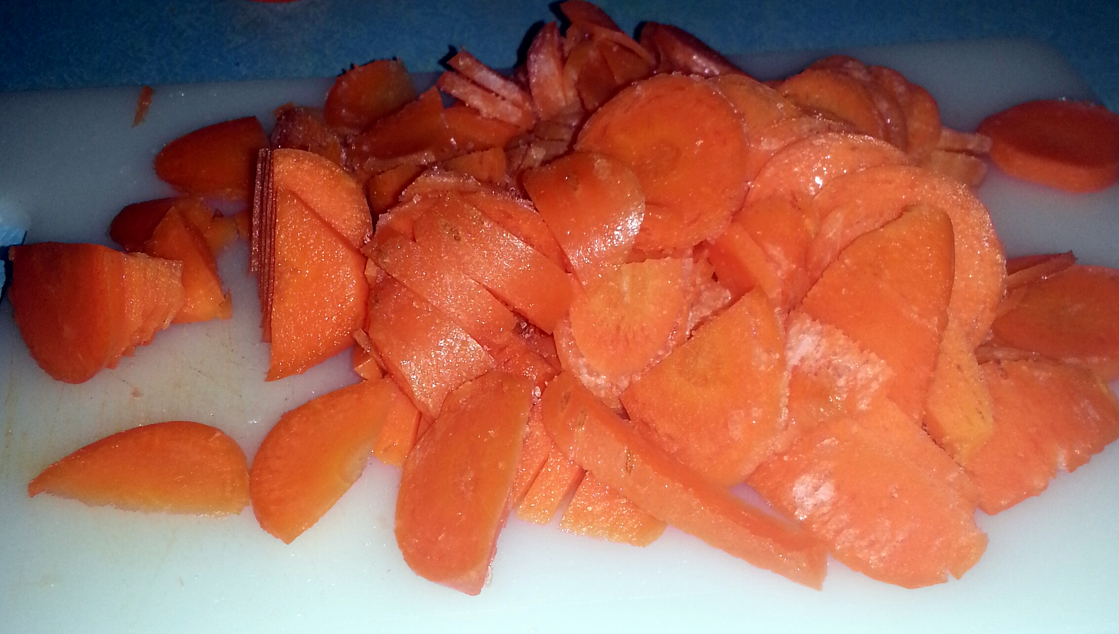 sliced up carrots on  board ready to cook