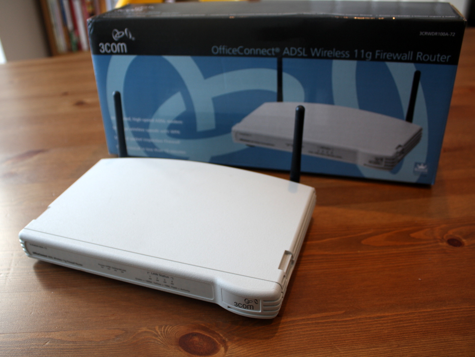 a white laptop and box sitting on a table