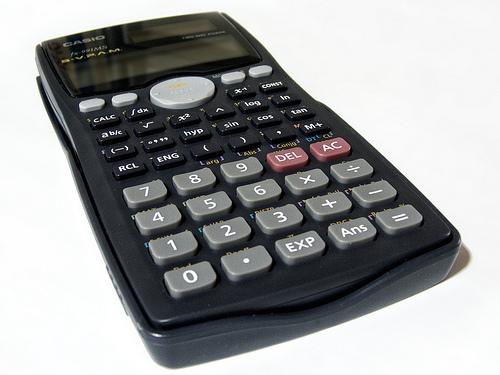 a black calculator with red numbers sitting on the table