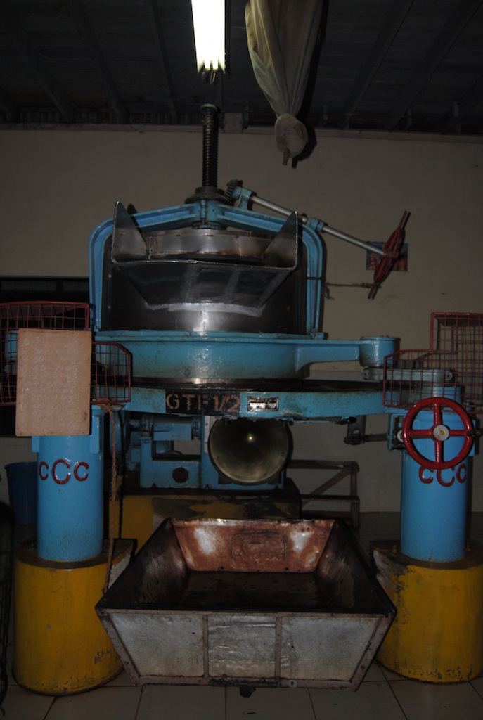 an old industrial machinery is sitting on display