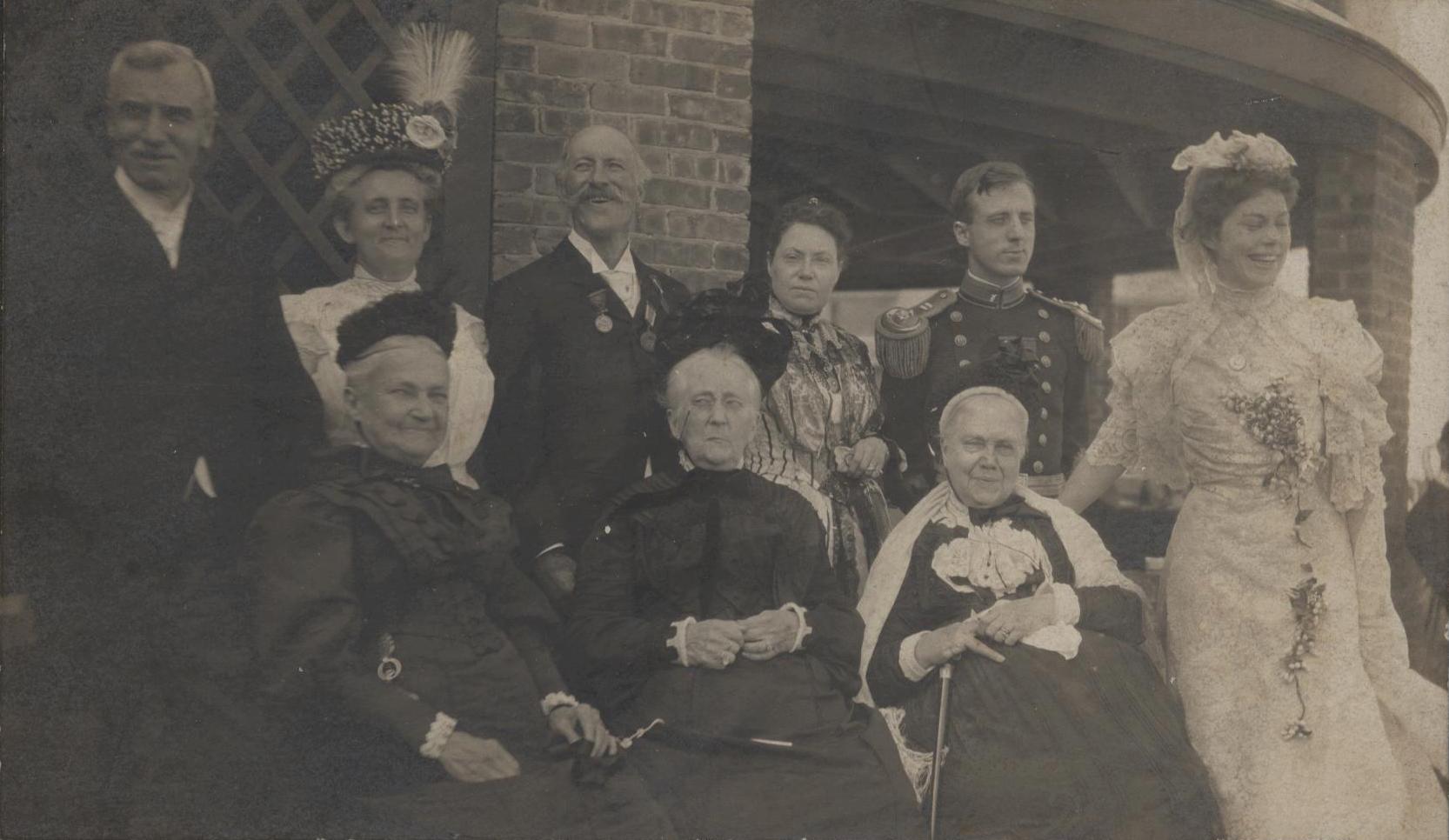 a group of people dressed in historical clothing posing for a picture