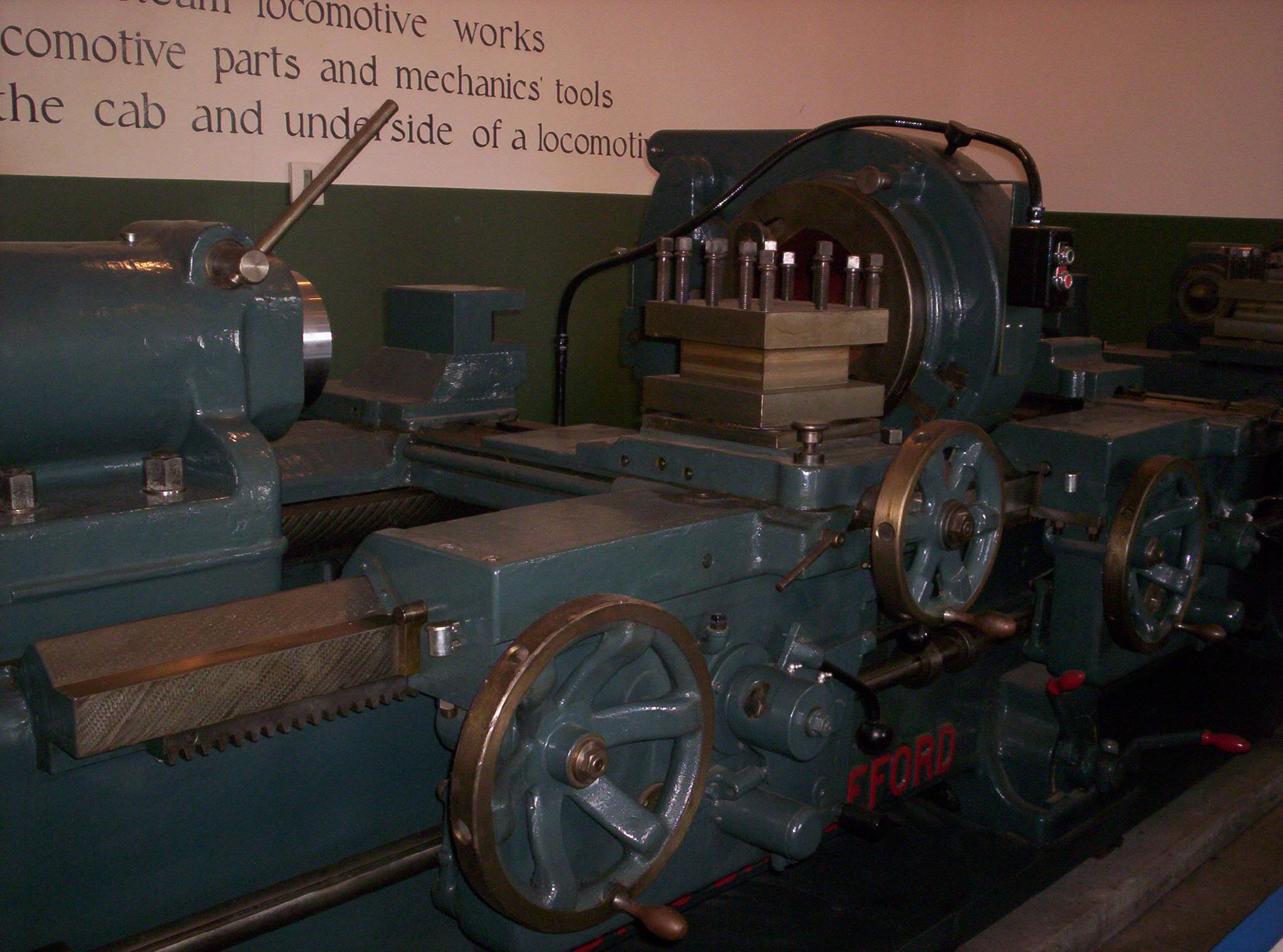 a close up of a machine that has wheels and bars