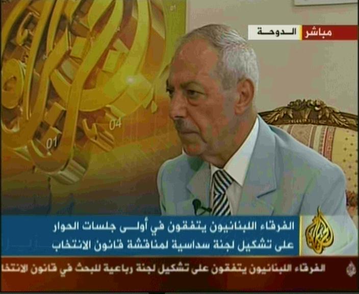 an arabic man speaking into a news segment