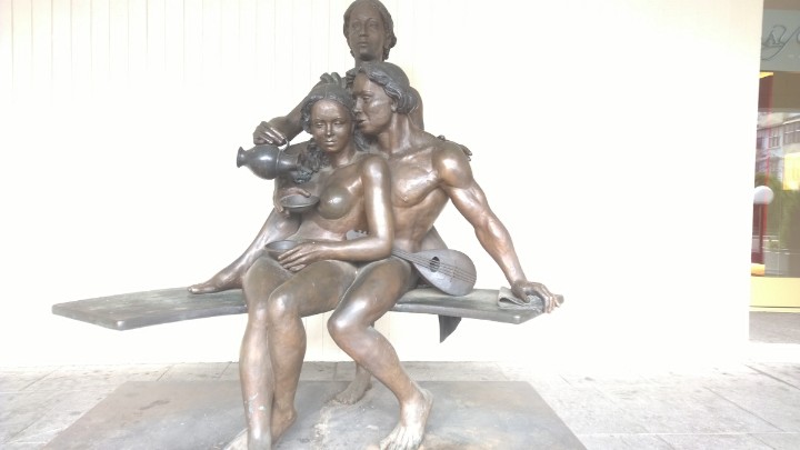 this is a statue of two women on a bench