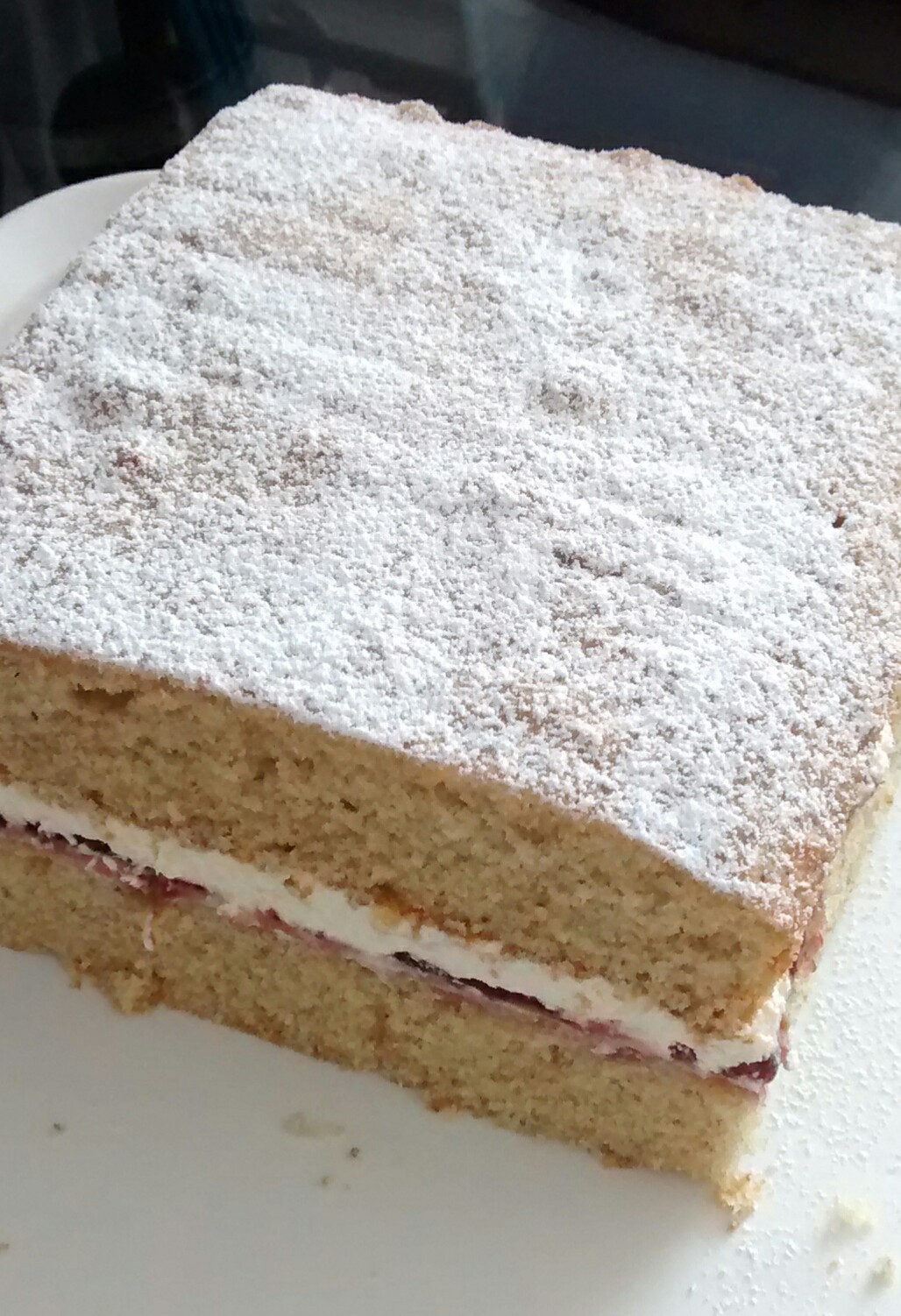 there is a slice of cake on a white plate