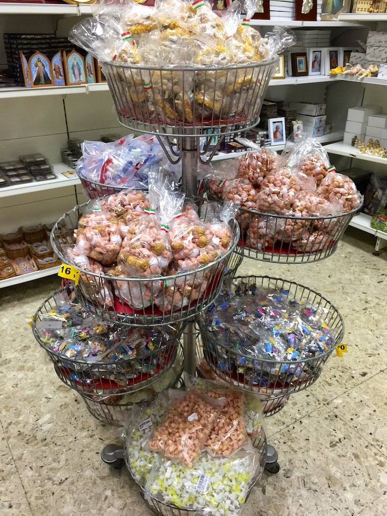 several baskets of donuts that are stacked up