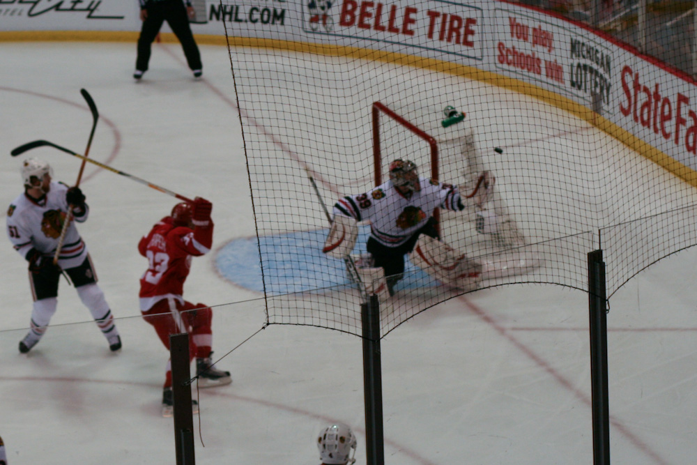 players in action on an ice hockey arena