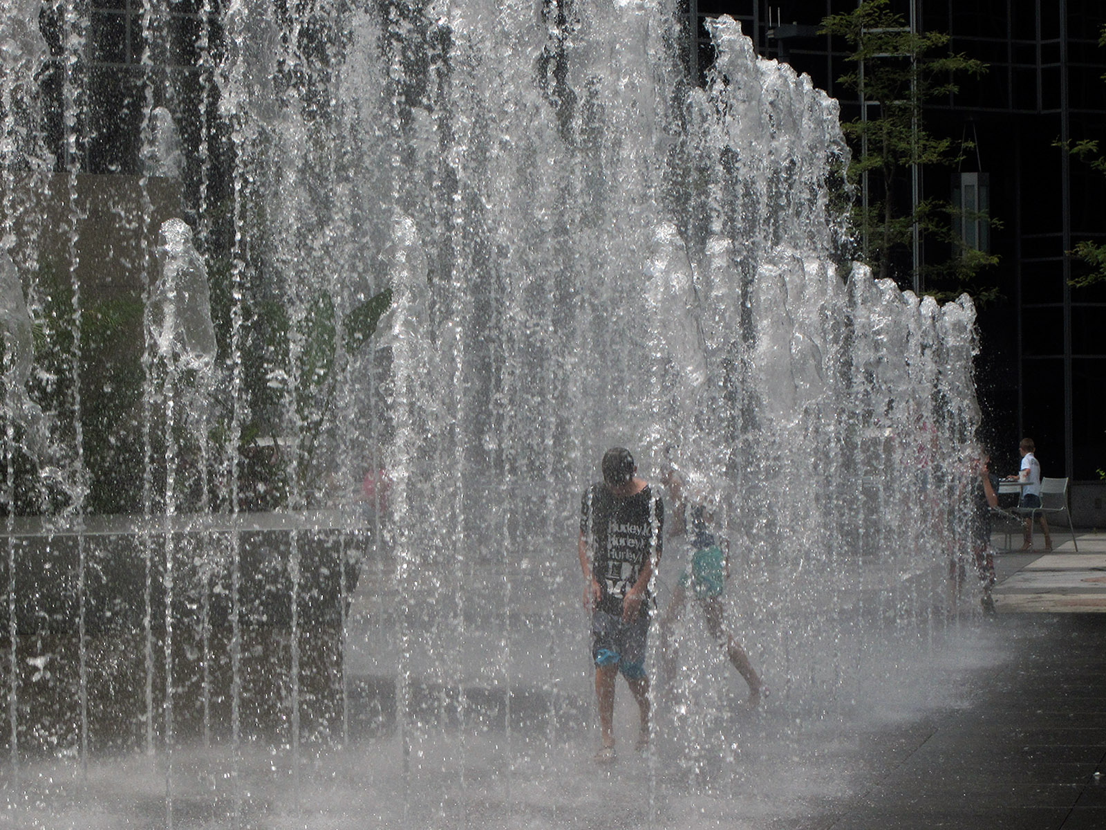 two s playing with an illuminated fountain