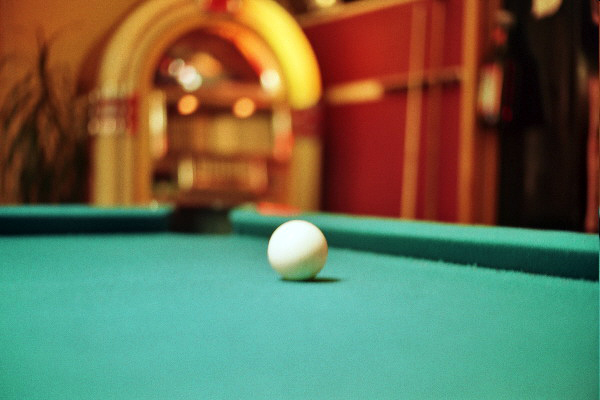 an image of a pool table with a ball on it
