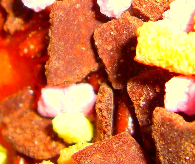 a close up of brown, yellow, and pink candies