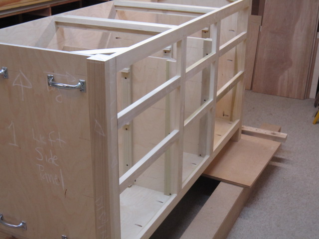 a plywood cabinet that is being constructed and put together
