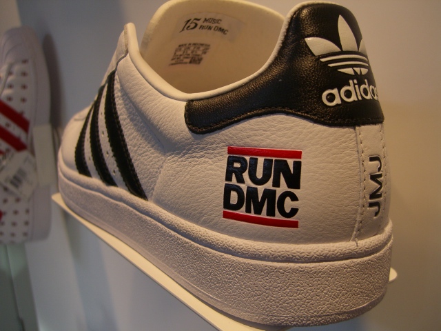adidas run d c sneakers with red, white and black logos