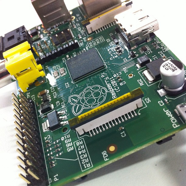 a raspberry is on display with the other parts being assembled