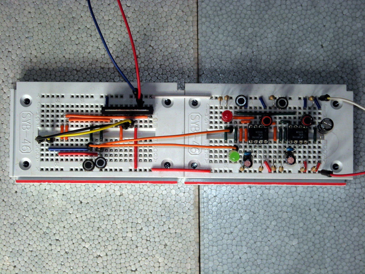 an electronic board with wires and components on it