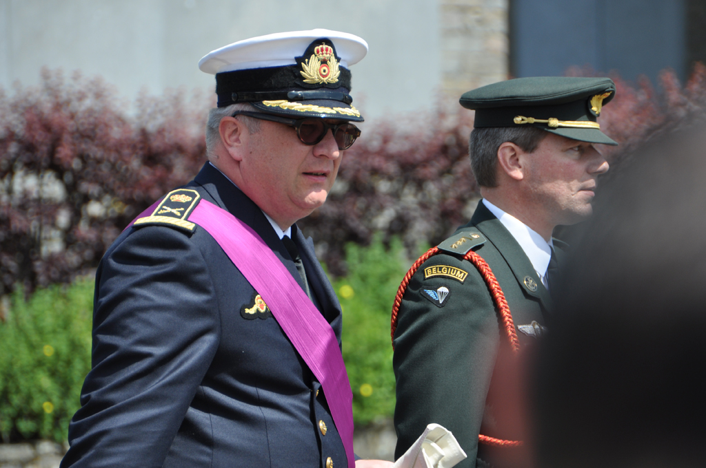 a group of men in uniforms walking past each other