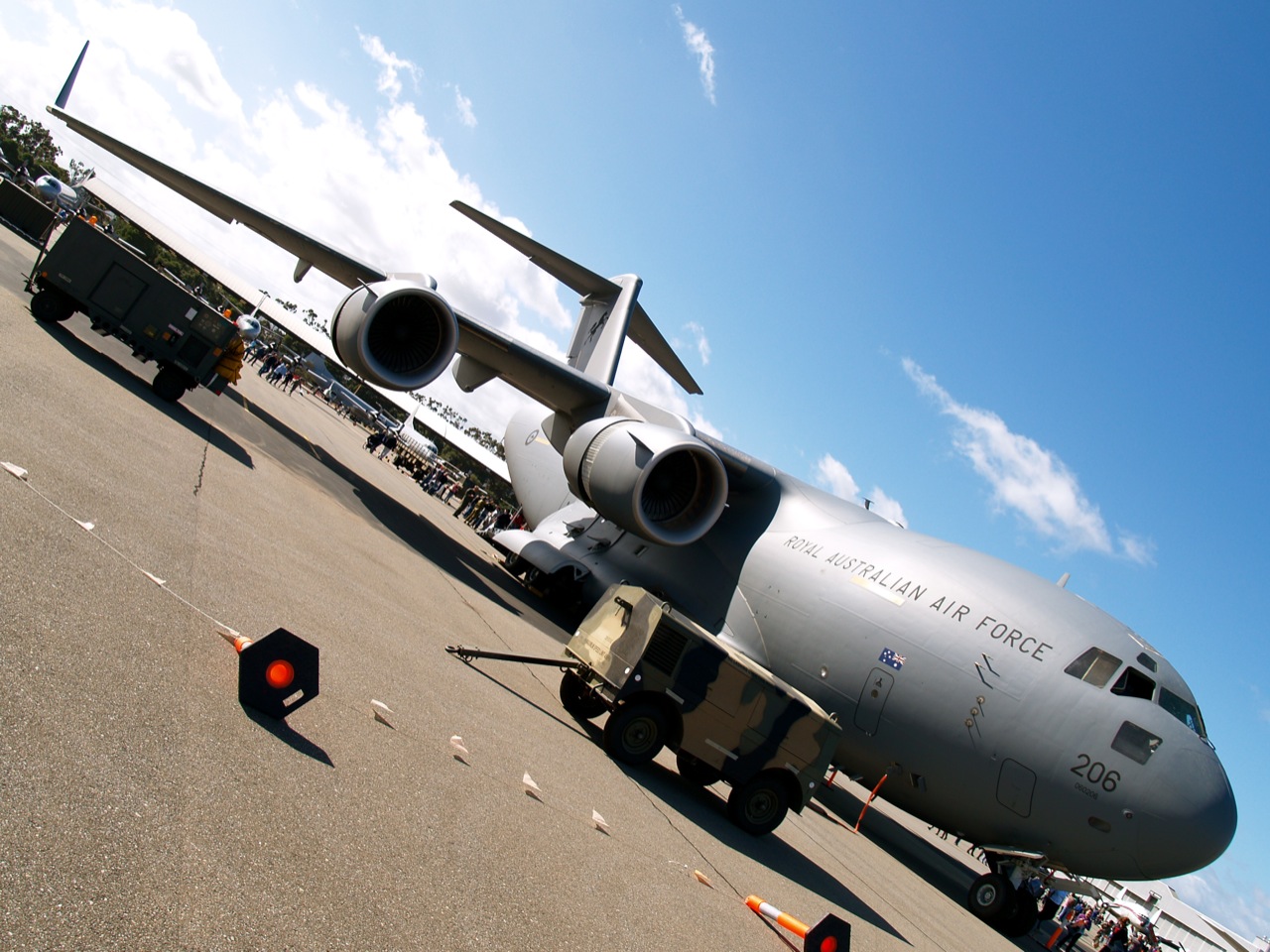 a large jetliner sitting on top of an airport runway