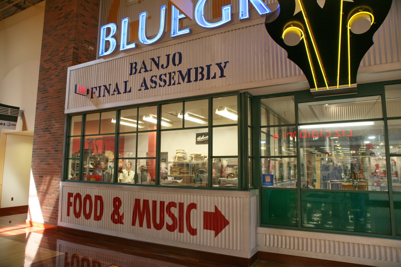 the front entrance of a building with food and music