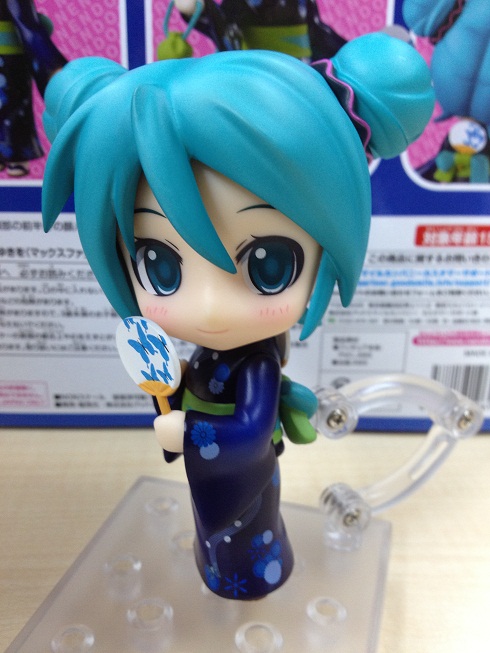 this is an anime figurine with blue hair