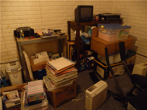 a room with a lot of boxes, electronics and boxes on the floor