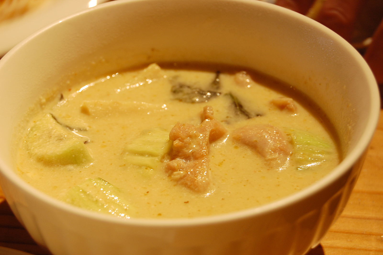 a bowl of soup containing meat and vegetables