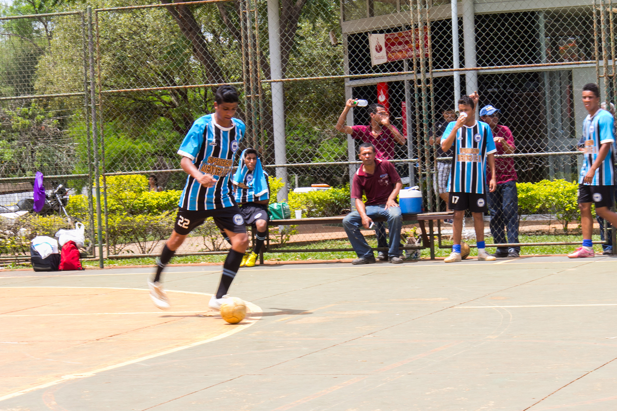 the s are playing soccer on the court