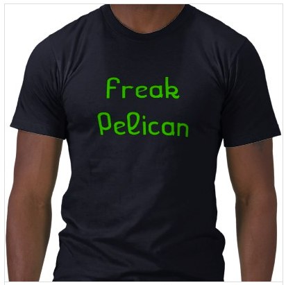 a man with his hands in his pockets wearing a t - shirt that reads freak pelican