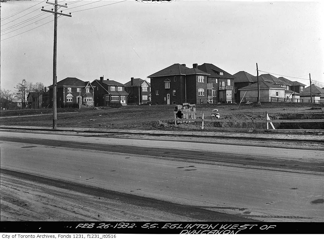 an old po shows the houses on the other side of the street