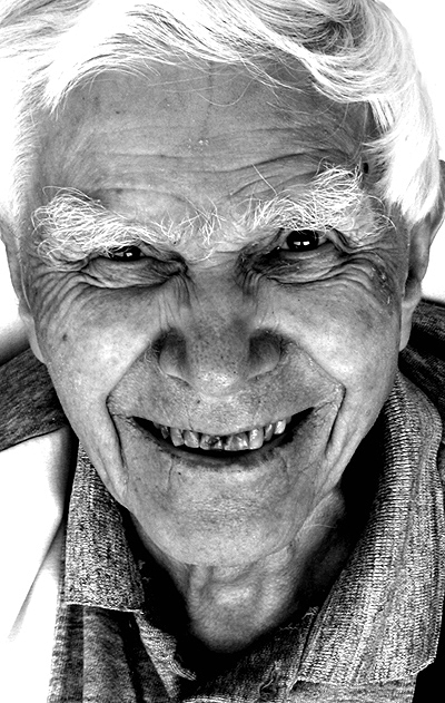 black and white pograph of an older gentleman smiling