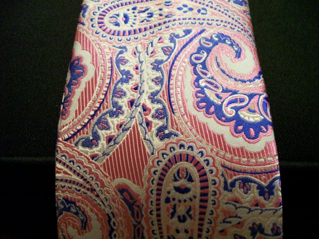 a multicolored paisley tie has intricate design