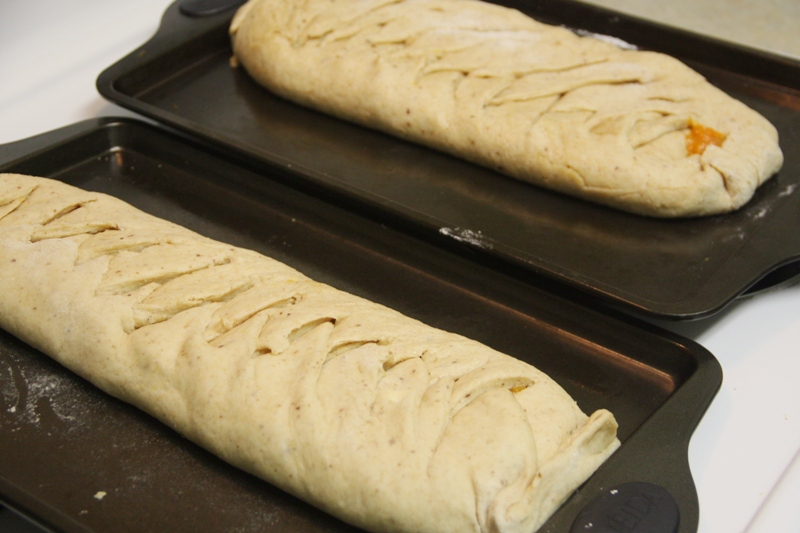 two long rolls sitting on top of pans