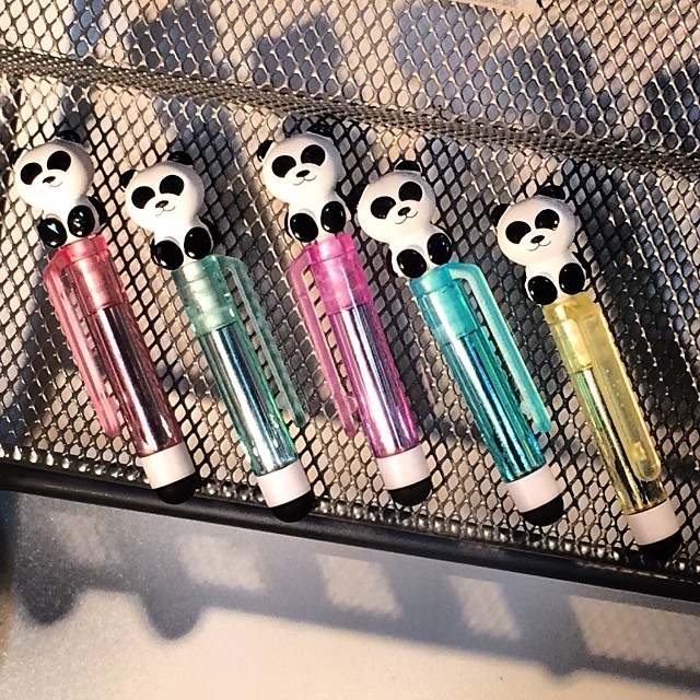 a rack holding a bunch of colorful lighters