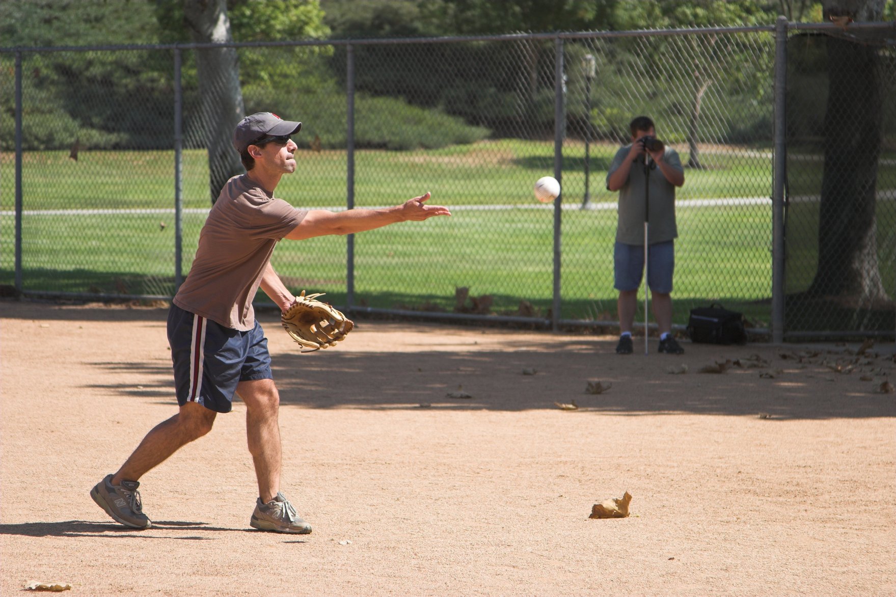 the young man is playing a game of baseball on the field