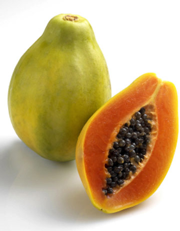 a green gudge and a ripe gfruit, both on white background