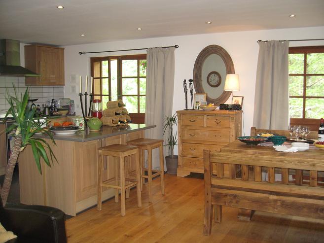 a wood kitchen and dining area features many items