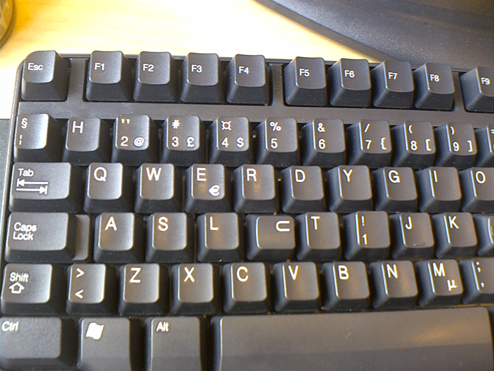 an image of a keyboard that is laying on the desk