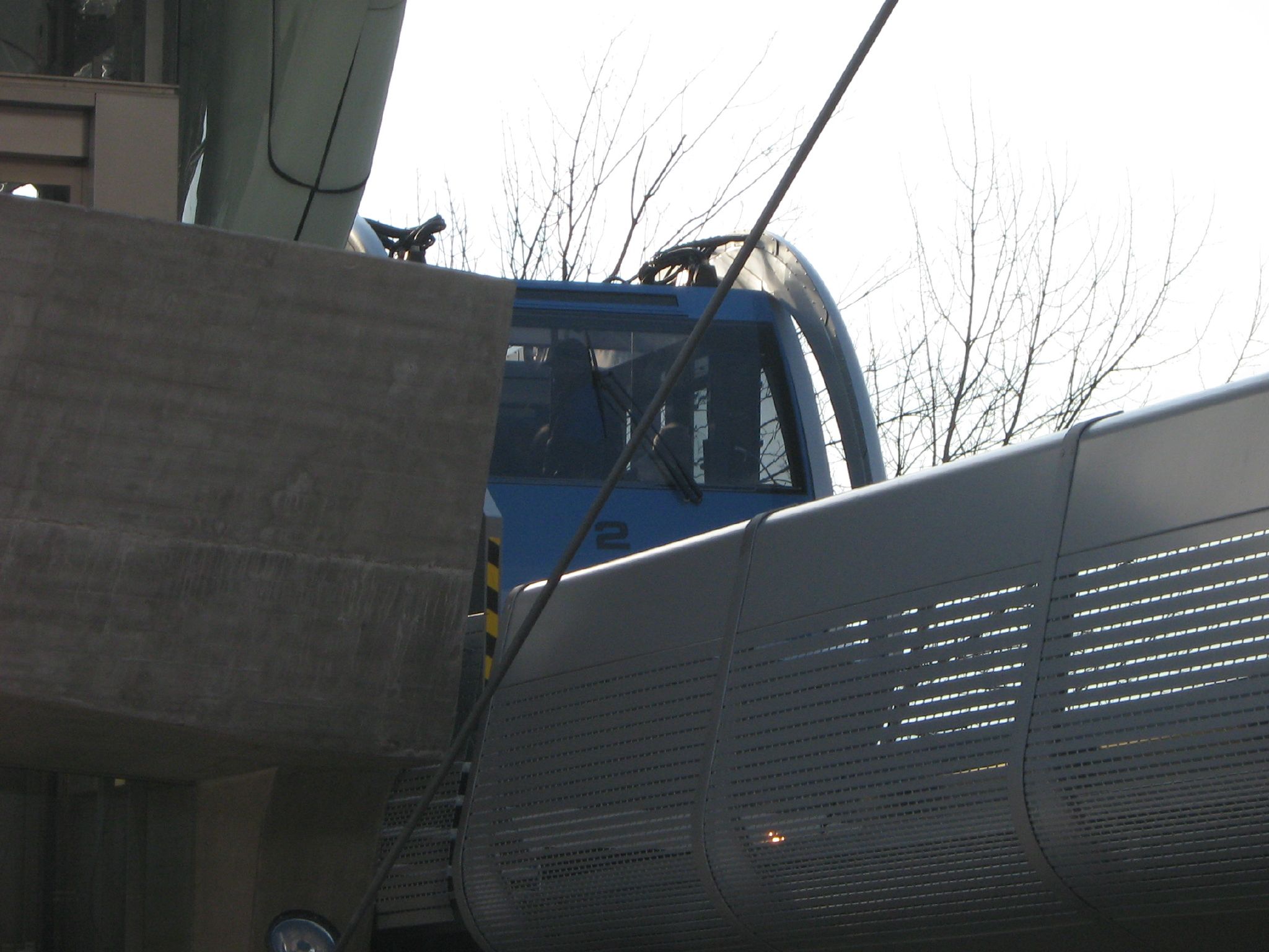 a blue train with its roof broken off