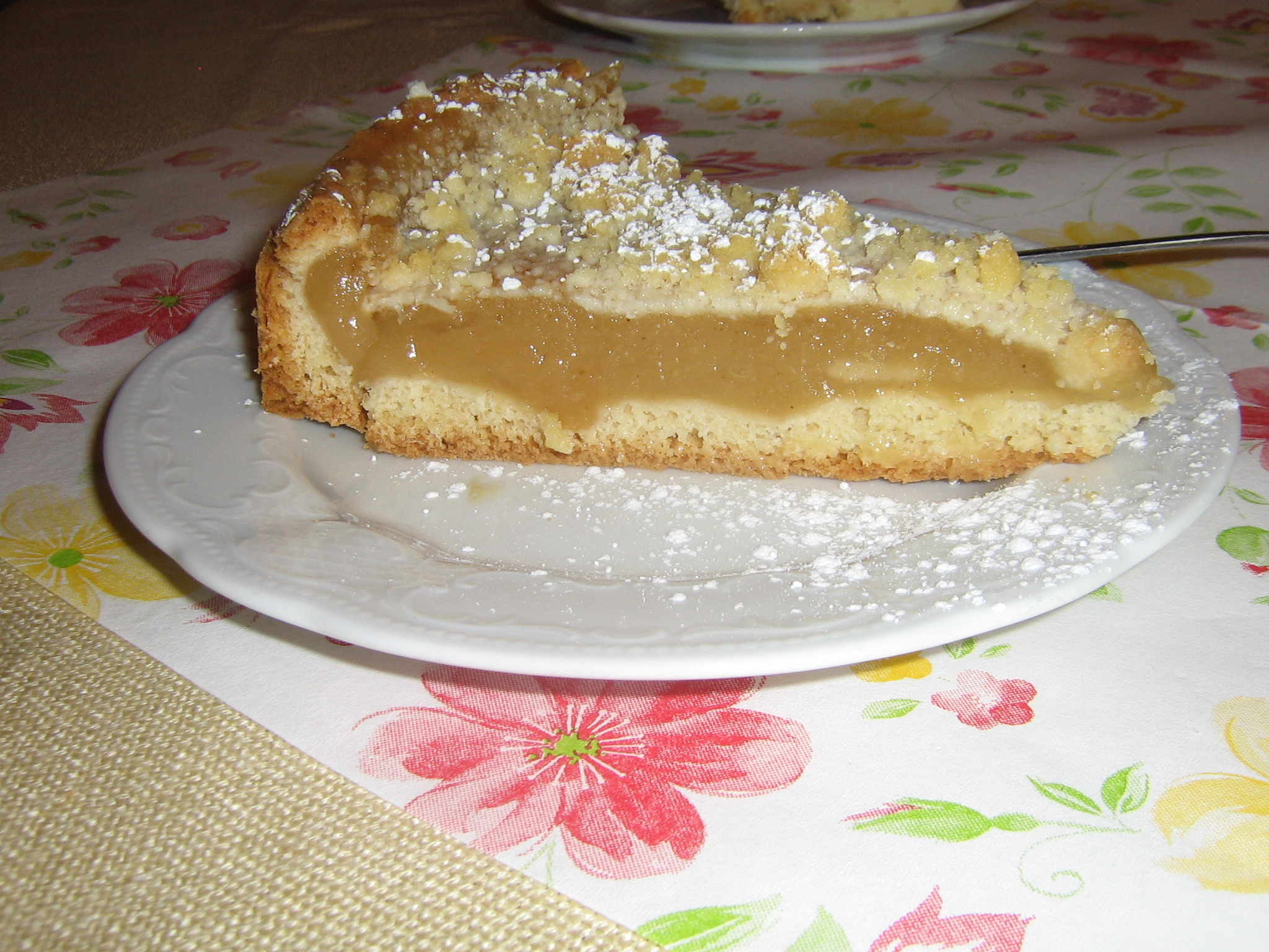 a plate of food on a table with flowers