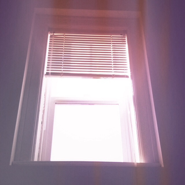 a close up view of a window and blinds