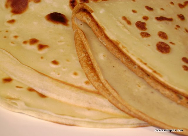 a stack of flat bread sitting on top of a white plate