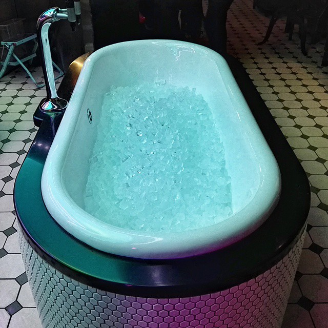 there is a bath tub made from concrete