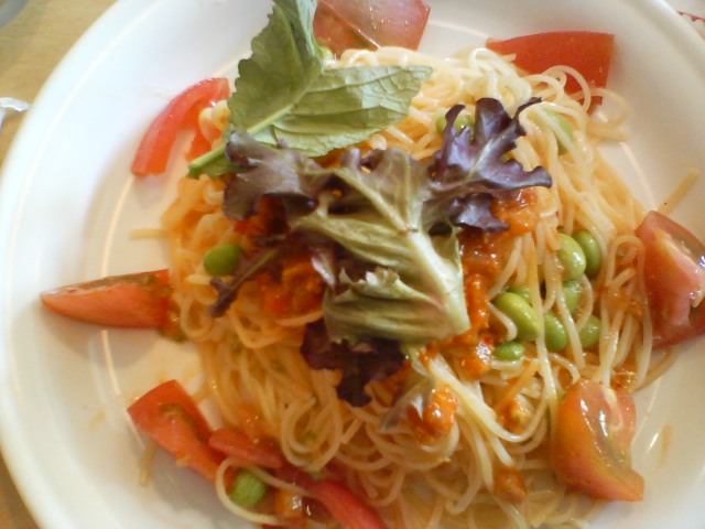 an image of noodles with tomatoes and vegetables