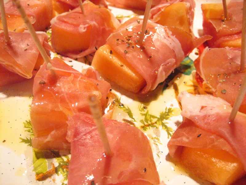 some fish is sitting on a plate with toothpicks