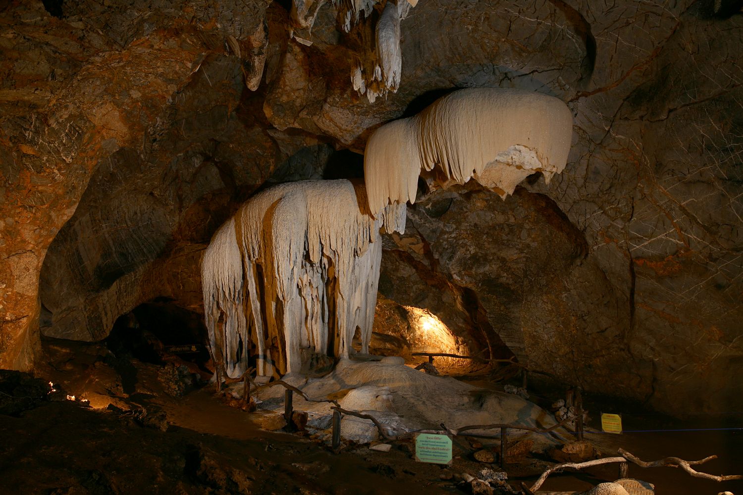 some ice hanging on the side of the cave